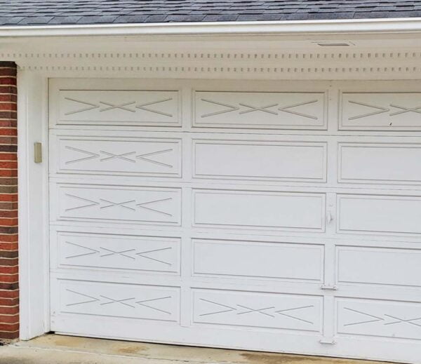 wood garage door for ranch house with carvings