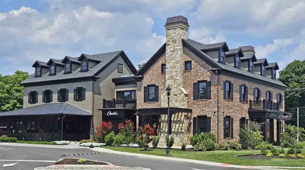 black trim with brick and black shutters.